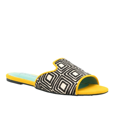 a pair of yellow and black slides with a black and white pattern
