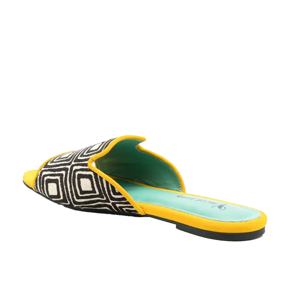 a pair of yellow and black slippers